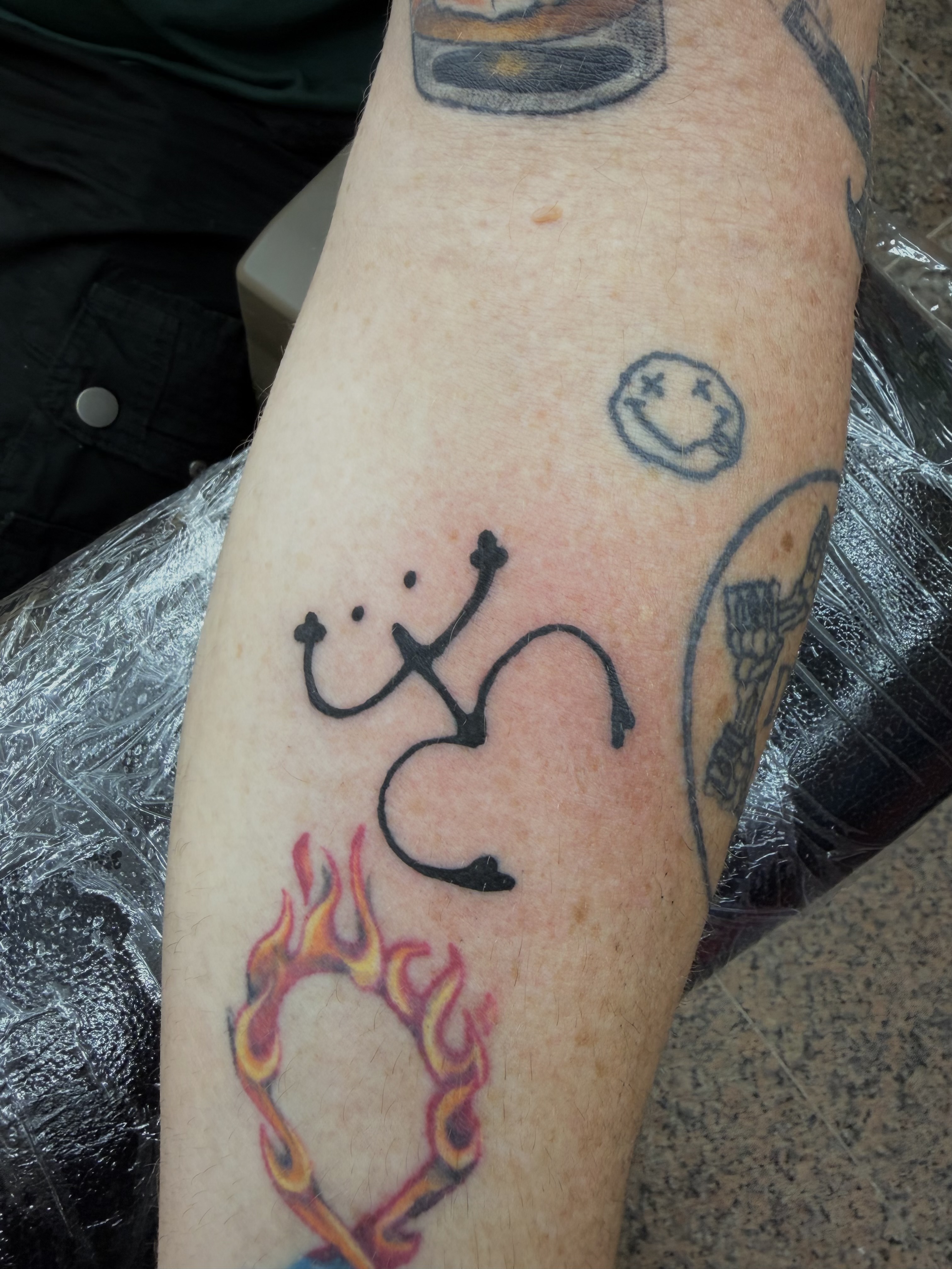 Fine line stethoscope and flaming heart tattoo by Angel J — AWJ Tattoos, Rio Grande Puerto Rico