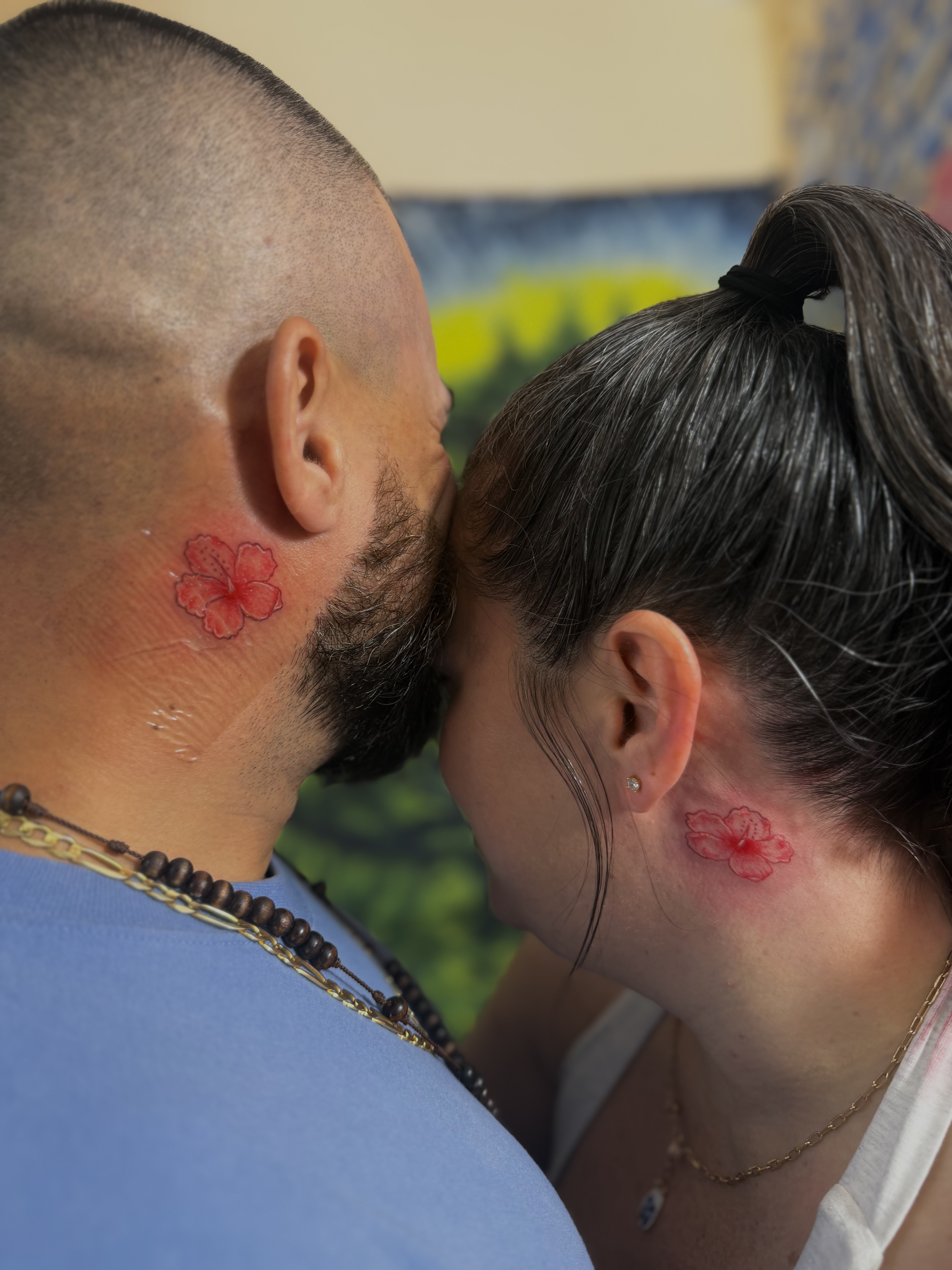 Matching hibiscus flash neck tattoos by Angel J — AWJ Tattoos, Rio Grande Puerto Rico